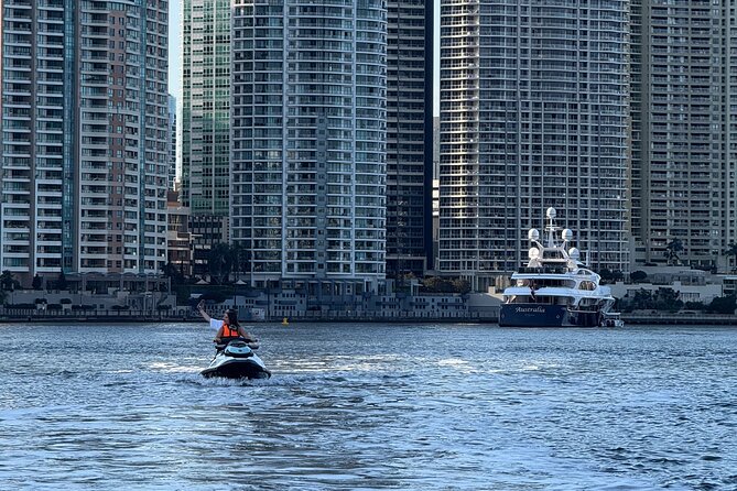 2 Hour Brisbane River Jetski Adventure - Brisbane from the water: homes, forest edges, and up-to-90-story scale